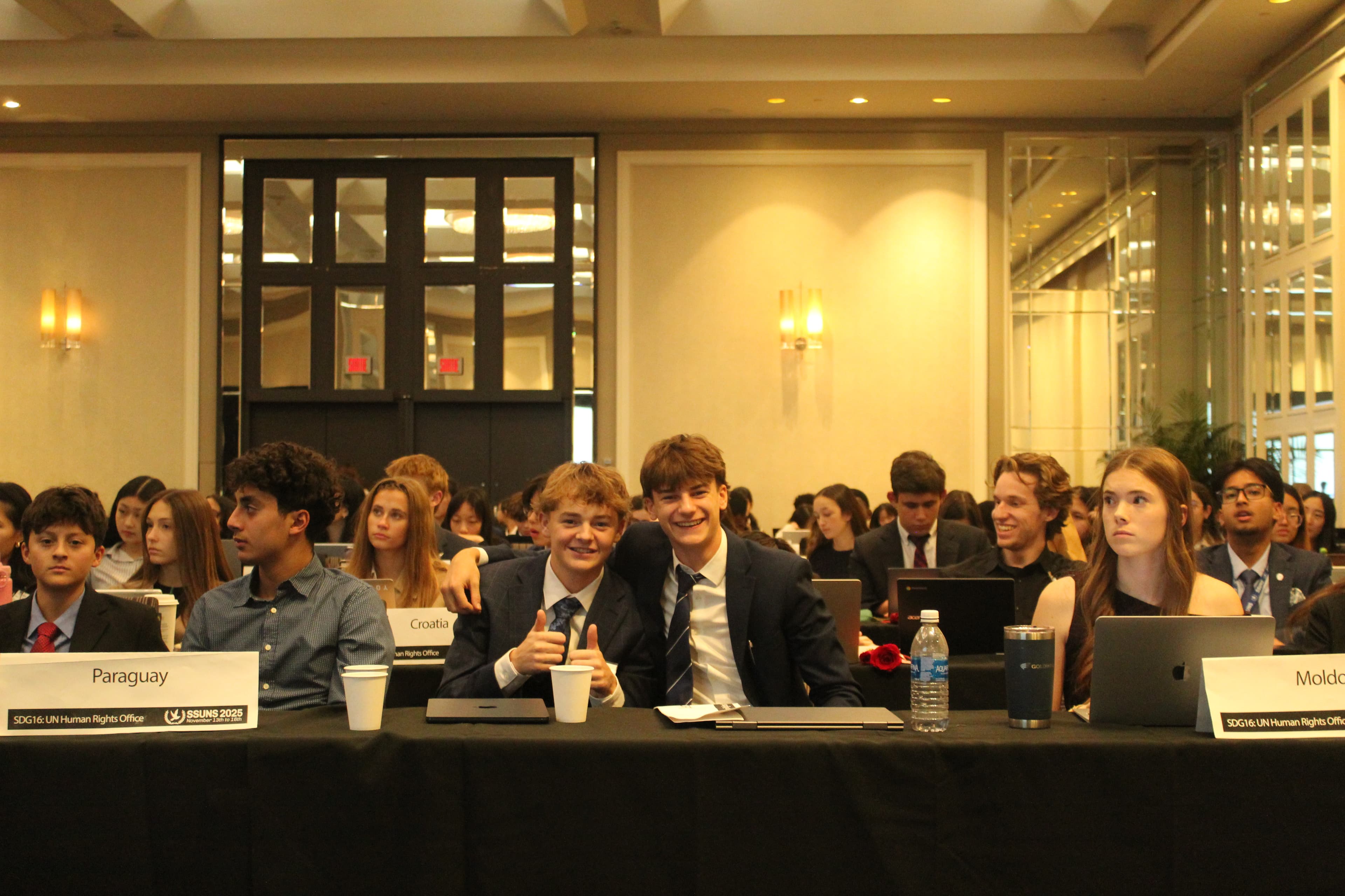Delegates debating in committee session
